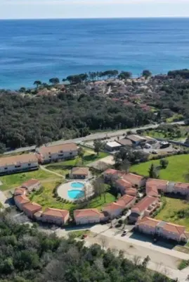 an aerial view of a house with a pool at VILLA MARYSABEL , maison T4 duplex, résidence villa de melody avec 2 piscines, mer à 500 m in Santa-Maria-Poggio