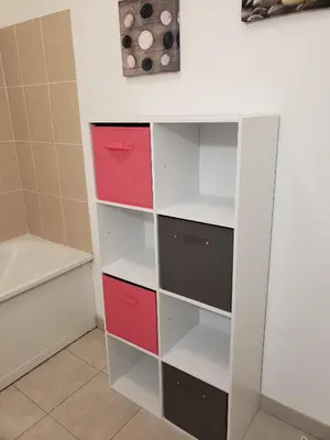 a closet with red and white shelves in a bathroom at VILLA MARYSABEL , maison T4 duplex, résidence villa de melody avec 2 piscines, mer à 500 m in Santa-Maria-Poggio
