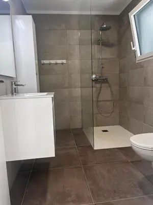 a bathroom with a shower and a toilet at T2 Porticcio neuf in Porticcio