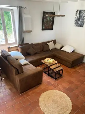 a living room with a couch and a table at L’Attellu in Feliceto