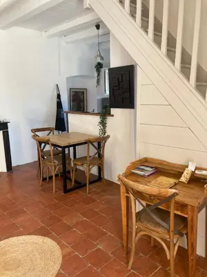 a dining room with a table and chairs at L’Attellu in Feliceto