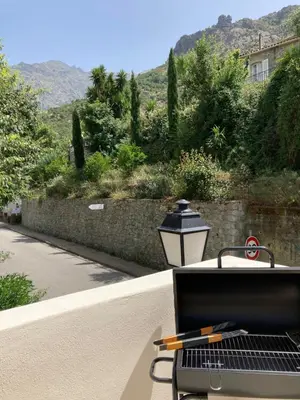 a grill sitting on a table with a street light at L’Attellu in Feliceto