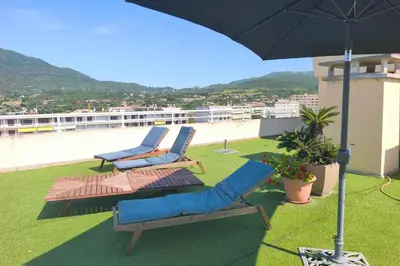 a group of chairs sitting on top of a roof at Bright Duplex - 360-degree view of Ajaccio in Ajaccio