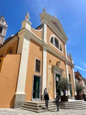 two people standing in front of a building at Grand T2 Cours Napoleon B in Ajaccio