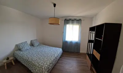 a small bedroom with a bed and a window at Vista mare in Ajaccio