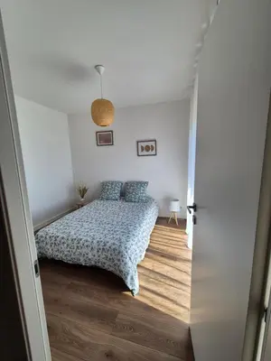 a bedroom with a bed with blue pillows on it at Vista mare in Ajaccio