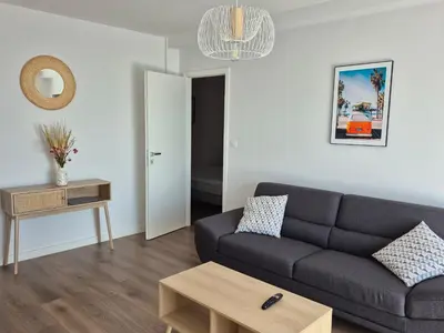 a living room with a couch and a table at Vista mare in Ajaccio