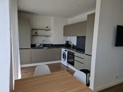 a kitchen with a table and chairs in a room at Vista mare in Ajaccio