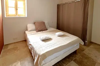 a bedroom with a bed with two towels on it at Casetta Tozza Di Conca in Conca