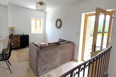 a living room with a couch and a table at Casetta Tozza Di Conca in Conca