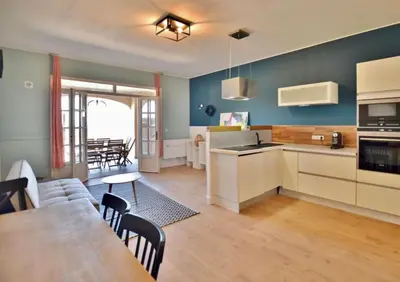 a kitchen and living room with a table and chairs at mare noi in Pietrosella