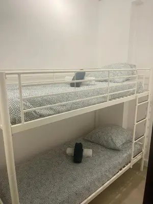 a bunk bed with a backpack on the bottom bunk at mare noi in Pietrosella