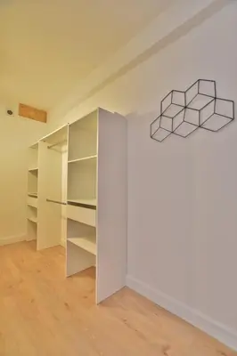 an empty room with white walls and shelves at mare noi in Pietrosella