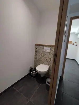 a bathroom with a toilet in a room at Farniente e Dolce vita in Olmeto