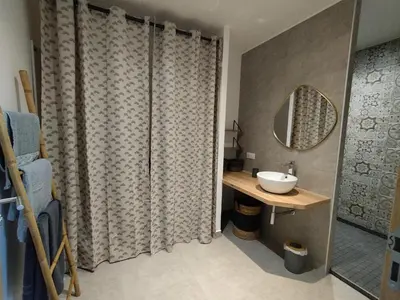 a bathroom with a sink and a mirror at Farniente e Dolce vita in Olmeto