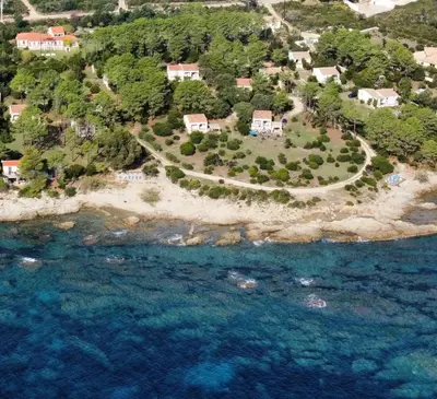 an aerial view of an island in the ocean at Domaine de Pianiccia in Favone
