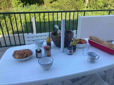 a white table with some food and drinks on it at Villa mina in Ghisonaccia