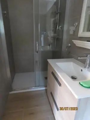 a bathroom with a shower and a sink and a shower at l'altore di savaghju in Vivario