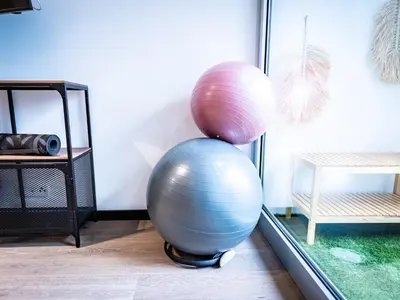 two balls sitting on top of each other in a room at Villa AzaiTu Suites in Porto-Vecchio