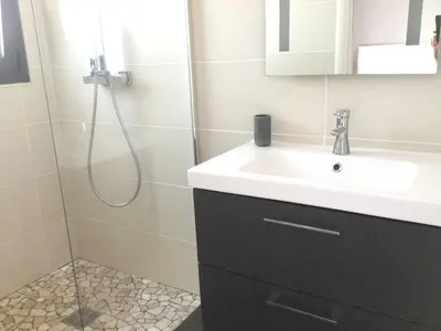 a bathroom with a sink and a shower at Villa élégante à Porto-Vecchio avec piscine privée in Porto-Vecchio