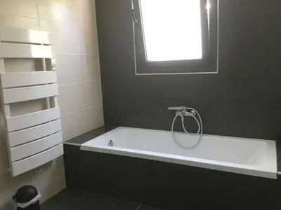 a bath tub in a bathroom with a window at Villa élégante à Porto-Vecchio avec piscine privée in Porto-Vecchio