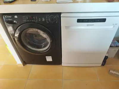 a washer and dryer in a kitchen at Havre de paix T3 vue mer in Conca