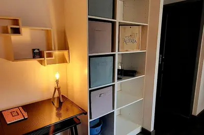 a room with a desk and a book shelf at Magnifique T2 in Ajaccio