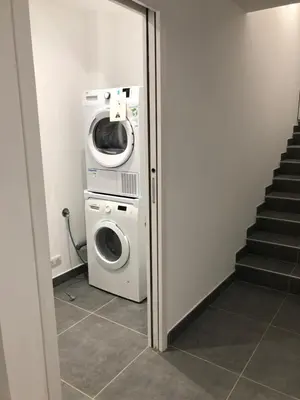 a laundry room with a washer and a washing machine at Casa a cucina in Propriano
