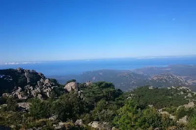 a view of the ocean from the top of a mountain at Maison en Corse in Monacia-dʼAullène