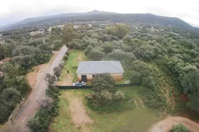 an overhead view of a house in the middle of a forest at Maison en Corse in Monacia-dʼAullène