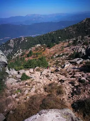 a person standing on top of a rocky mountain at Maison en Corse in Monacia-dʼAullène