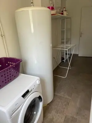 a washer and dryer in a kitchen with a counter at Villa 3 chambres avec piscine privative in Ajaccio