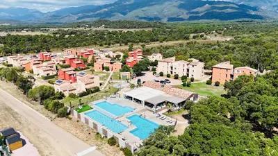 an aerial view of a house with a swimming pool at Résidence les Hameaux de Saint Cyprien appartement LUNA 132 in Lecci