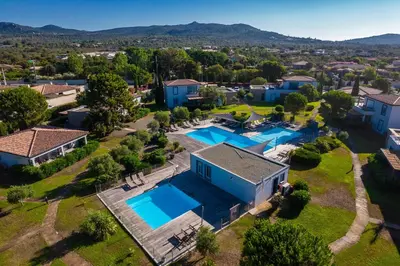 an aerial view of a house with two swimming pools at Résidence Pierre & Vacances Premium Les Villas de Porto-Vecchio in Porto-Vecchio
