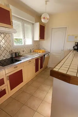 a kitchen with a sink and a counter top at Villa à Pinarello-2mn à pied de la plage-vue mer in Pinarellu