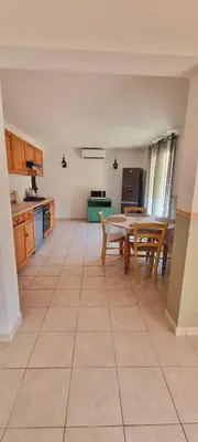 a kitchen with a table and a tableasteryasteryasteryasteryasteryasteryasteryastery at A CASA DI ROSA in Serra-di-Ferro