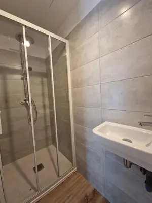 a bathroom with a shower and a sink at Résidence Fiori di Cala Rossa in Lecci