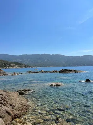 a large body of water with rocks in the water at Casa Di Lucianu in Casaglione