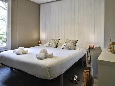 a bedroom with a large white bed with two pillows at Propriano Chalet near Sandy Beaches in Propriano