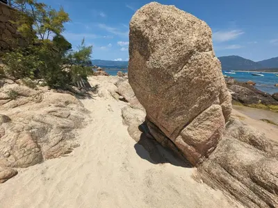 a large rock sitting on a sandy beach at Propriano Chalet near Sandy Beaches in Propriano