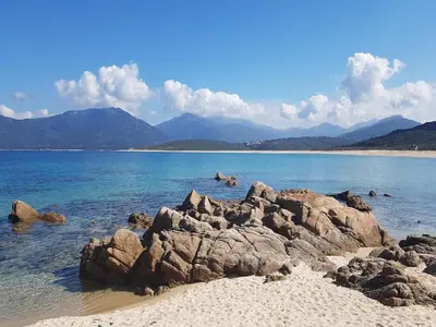 a group of people swimming in the water on a beach at Propriano Chalet near Sandy Beaches in Propriano