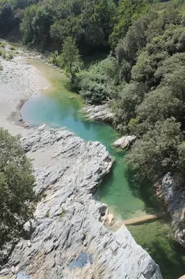 an aerial view of a river with rocks and trees at Maison centre-ville in Penta-di-Casinca