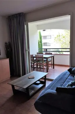a living room with a couch and a table at Casa Emma les pieds dans l'eau in San-Nicolao