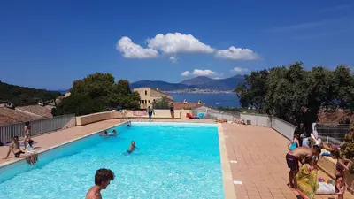 a group of people in a swimming pool at TB Porticcio vue mer in Grosseto-Prugna