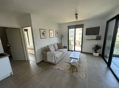 a living room with a couch and a table at Magnifique T2 ajaccio in Ajaccio