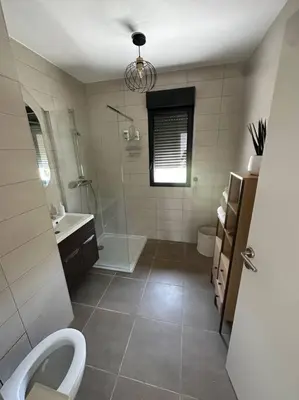 a bathroom with a toilet and a shower and a sink at Magnifique T2 ajaccio in Ajaccio