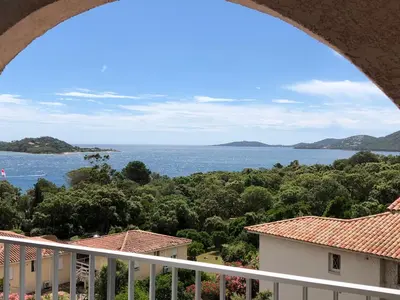 a view of the ocean from a balcony at Résidence les pieds dans l'eau in Porto-Vecchio