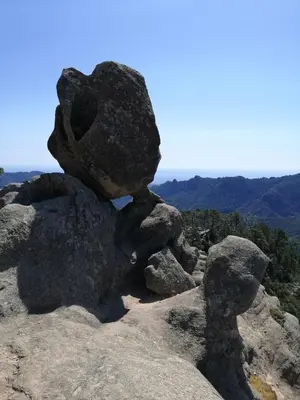 a pile of rocks on top of a mountain at Les chalets de Palavesa in Porto-Vecchio
