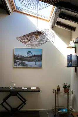 a skylight in a room with a table and a ceiling at Appartement vue sur le port - Chez Carlu in Bonifacio