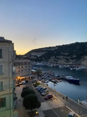 a view of a harbor with boats in the water at Appartement vue sur le port - Chez Carlu in Bonifacio